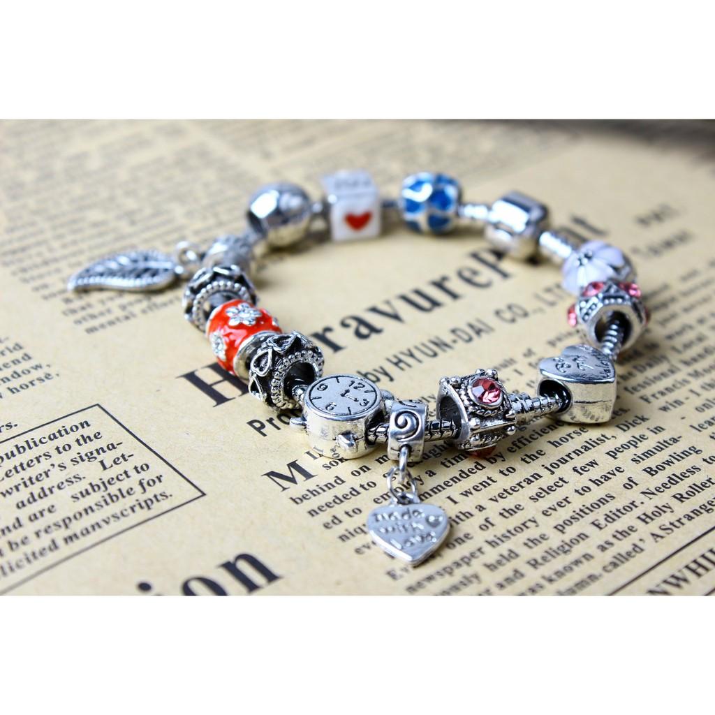 Vòng tay charm đồng hồ và chiếc lá