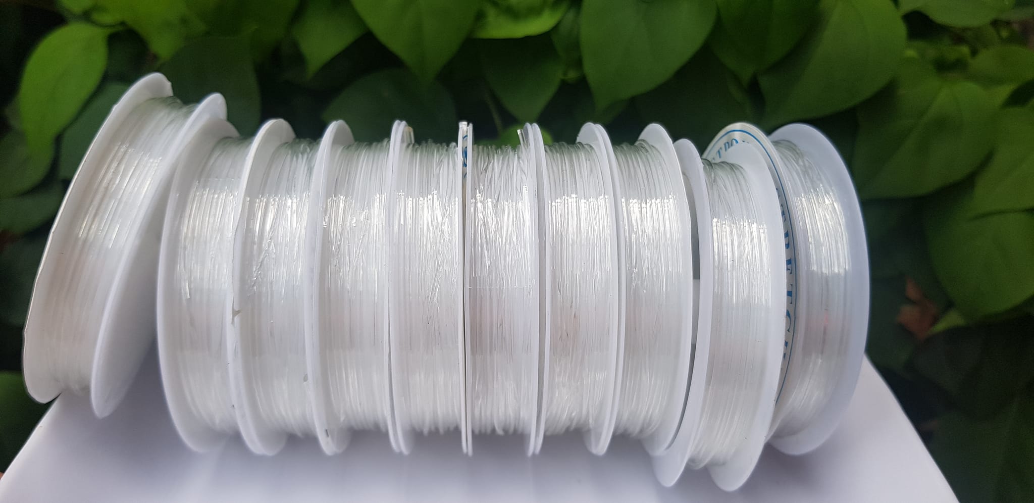 Khoanh tròn cuộn Thun Dẻo Màu trắng nhỏ chuyên xỏ tất cả vòng đeo tay Thun dẻo trắng xỏ vòng tay nam nữ ạ