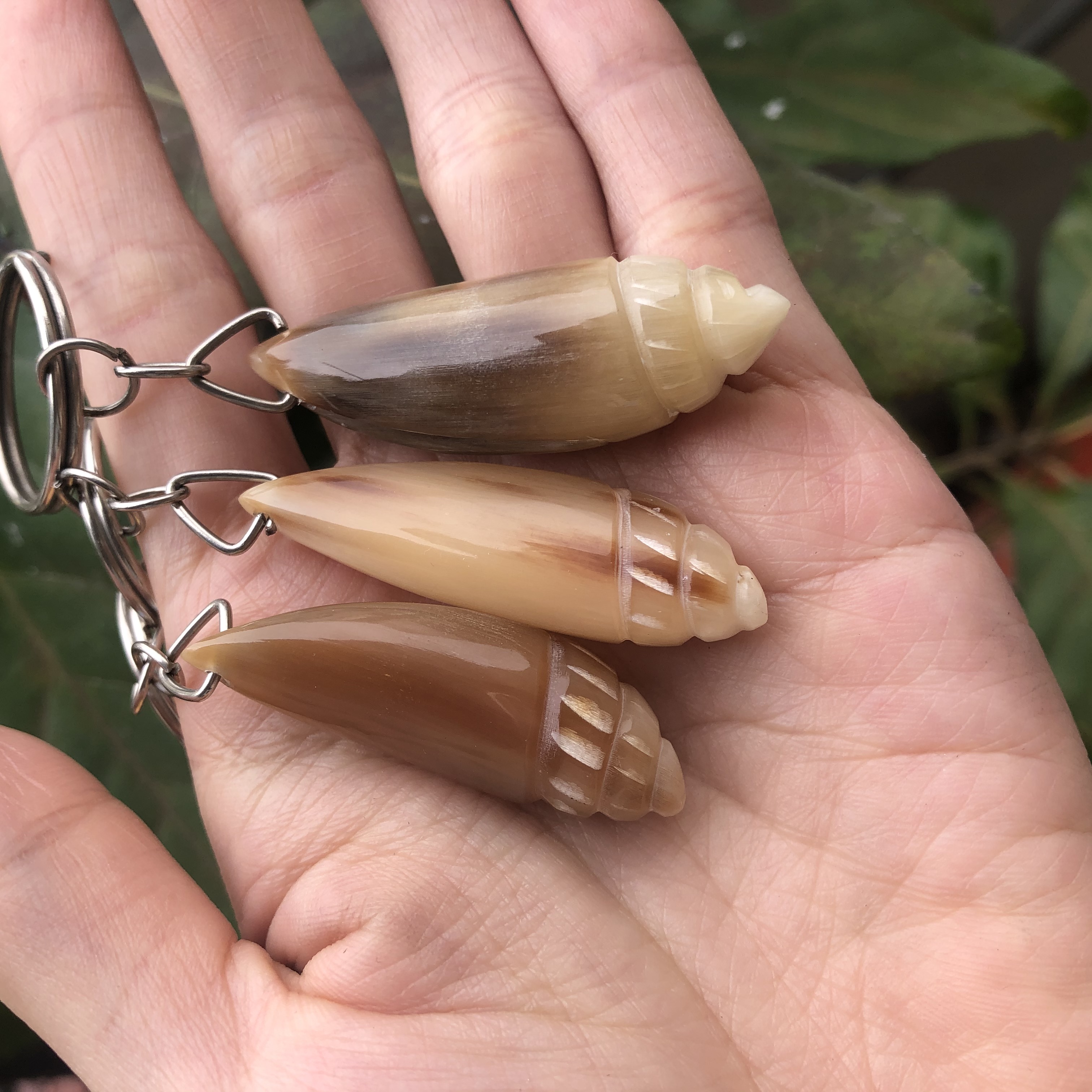 Móc treo chìa khóa hình con ốc được làm bằng chóp sừng Hình dáng độc đáo, lạ mắt