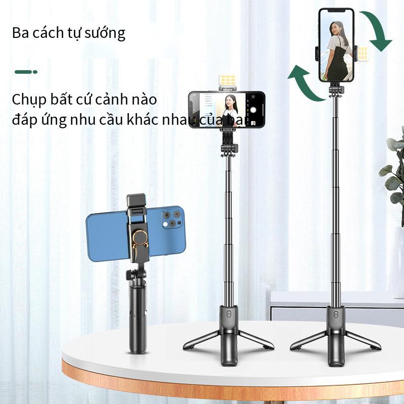 Phong cách mới nhất mini ba chân tất cả trong một selfie stick lưới màu đỏ phát sóng trực tiếp ngoài trời di động cầm tay bluetooth chống rung tạo tác vẻ đẹp