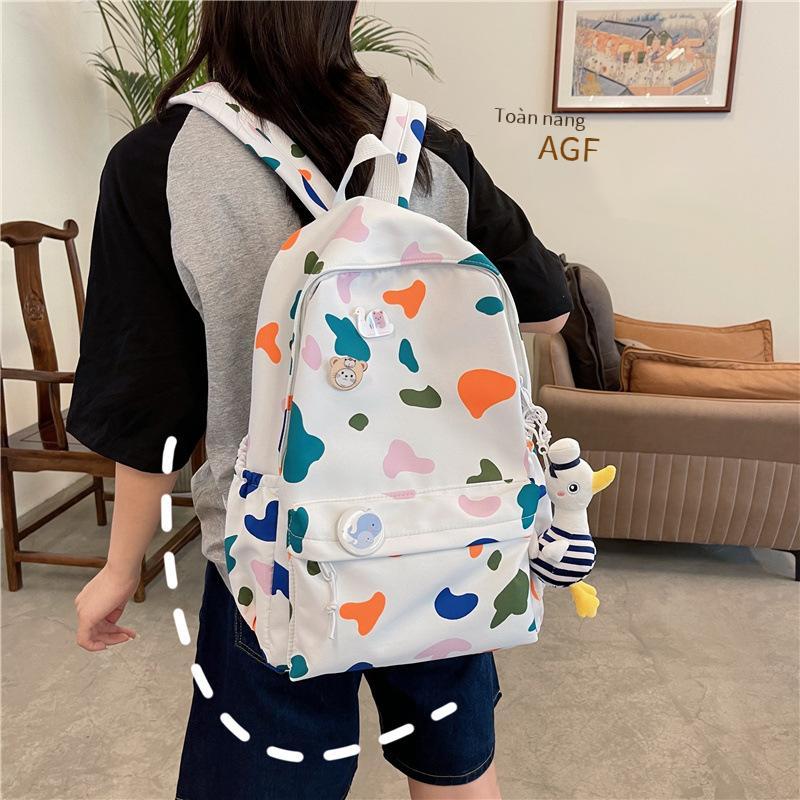Ba lô học sinh nữ phong cách mới nhất phong cách Hàn Quốc thời trang học sinh trung học ba lô nylon in ba lô hợp thời trang sức chứa lớn ba lô học sinh trung học cơ sở
