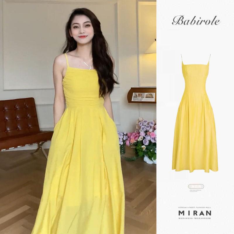 DIYIWEI Tea Break French Sling Dress 2023 Mùa hè bờ biển nghỉ mát thắt lưng có vẻ gầy màu vàng một chữ đầm dài