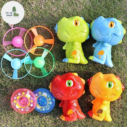 Đồ chơi bắn chong chóng phát sáng hình khủng long cực dễ thương dành cho bé,máy bắn con quay hình khủng long