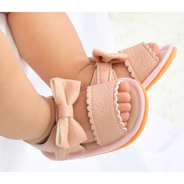 Giày sandal tập đi cho bé đế cao su chống trơn trượt chất da mềm cực chất đính nơ dễ thương cho b