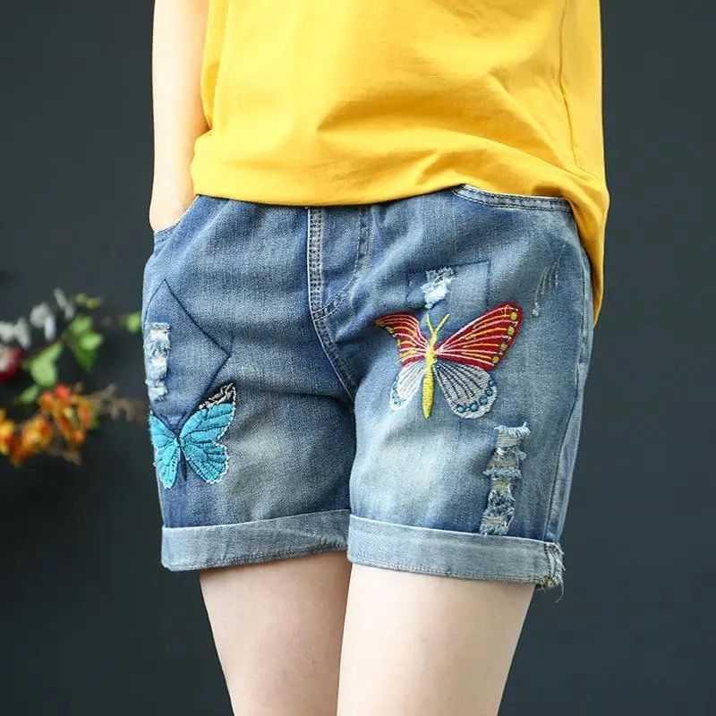 Quần Short Jean Lưng Cao Ống Rộng Thêu Họa Tiết Thiết Kế Rách Cá Tính Cho Nữ