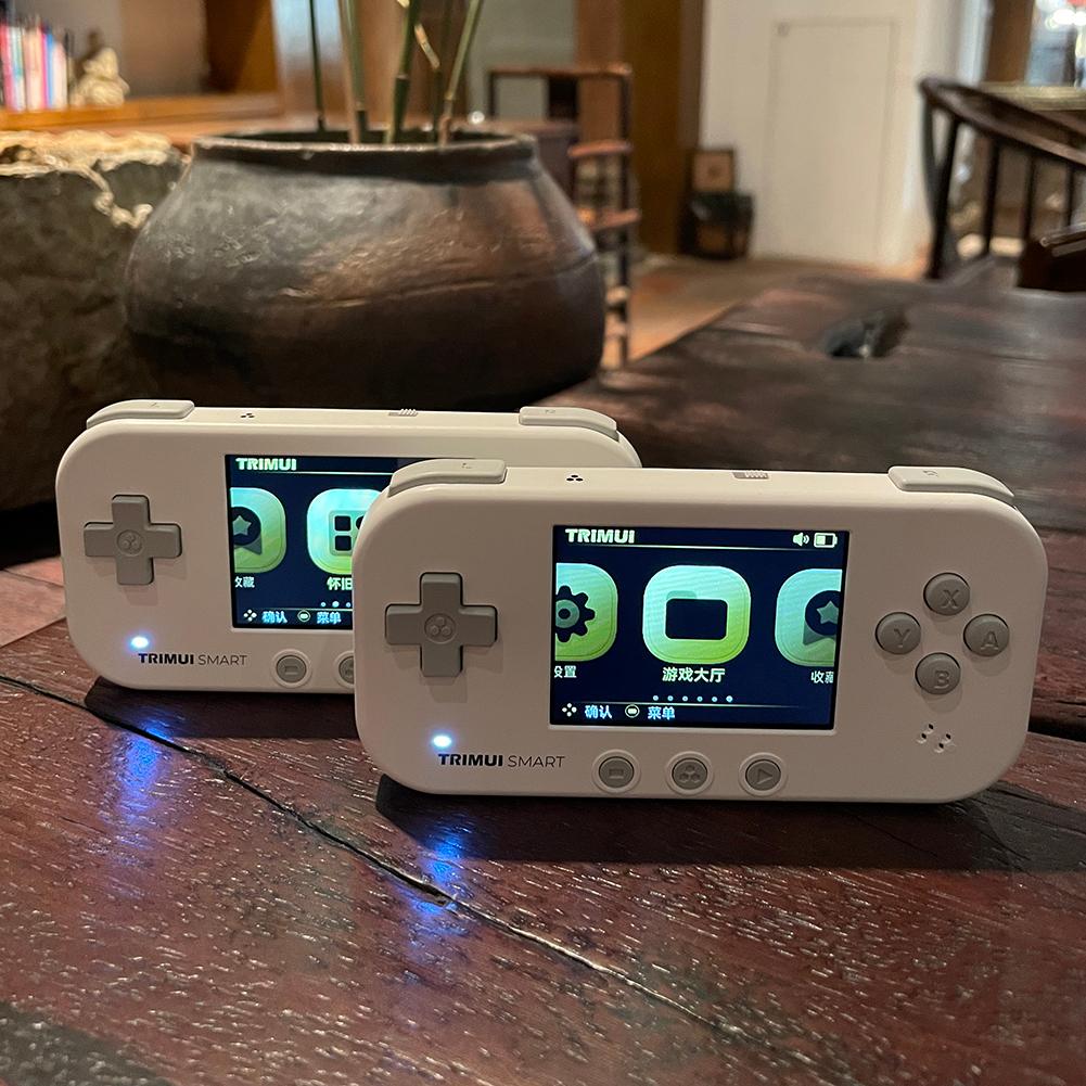 Trimui thông minh Retro Handheld Trò chơi bảng điều khiển di động Mini tích hợp 15000 Trò chơi cổ điển Trò chơi 2,4 inch Trò chơi Trò chơi giải trí tại nhà: Màu tím không có thẻ