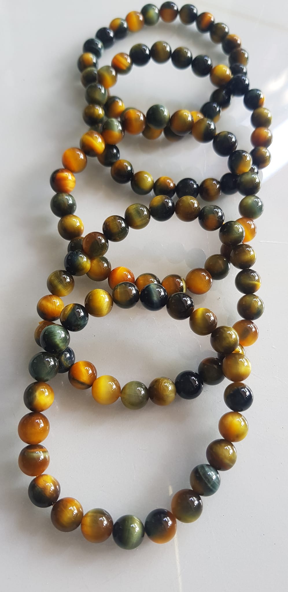 Vòng tay phong thủy may mắn Nữ đá mắt hổ tự nhiên vàng xanh đều mới bóng mượt đẹp Size hạt 8mm Nữ đeo Công dụng vòng đá mắt hổ đá thiên nhiên tốt cho sức khỏe, đem đến may mắn,xoa dịu tâm trí công việc hanh thông ạ