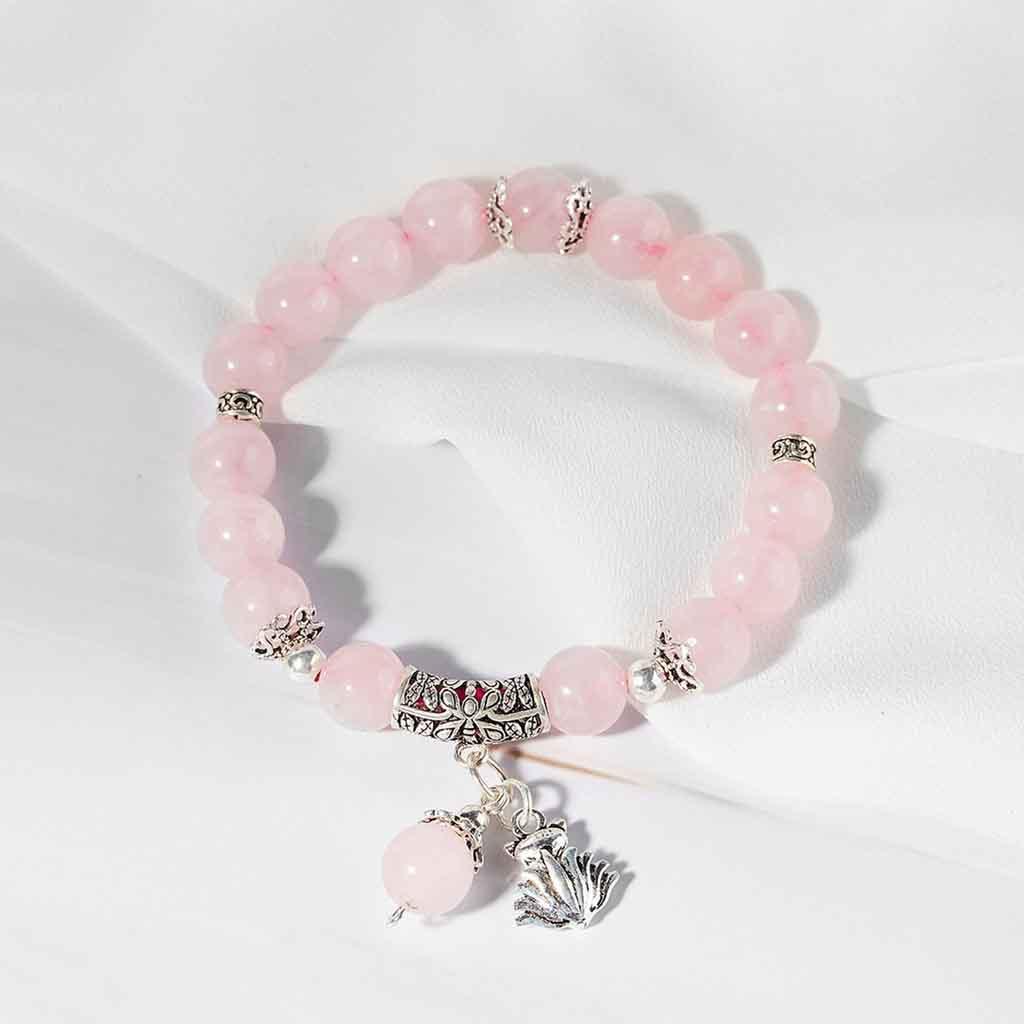 Vòng đá. Thach Anh Hồng chất lượng 5A mix charm cỏ 4 lá xinh xắn hợp mệnh Hỏa và Thổ