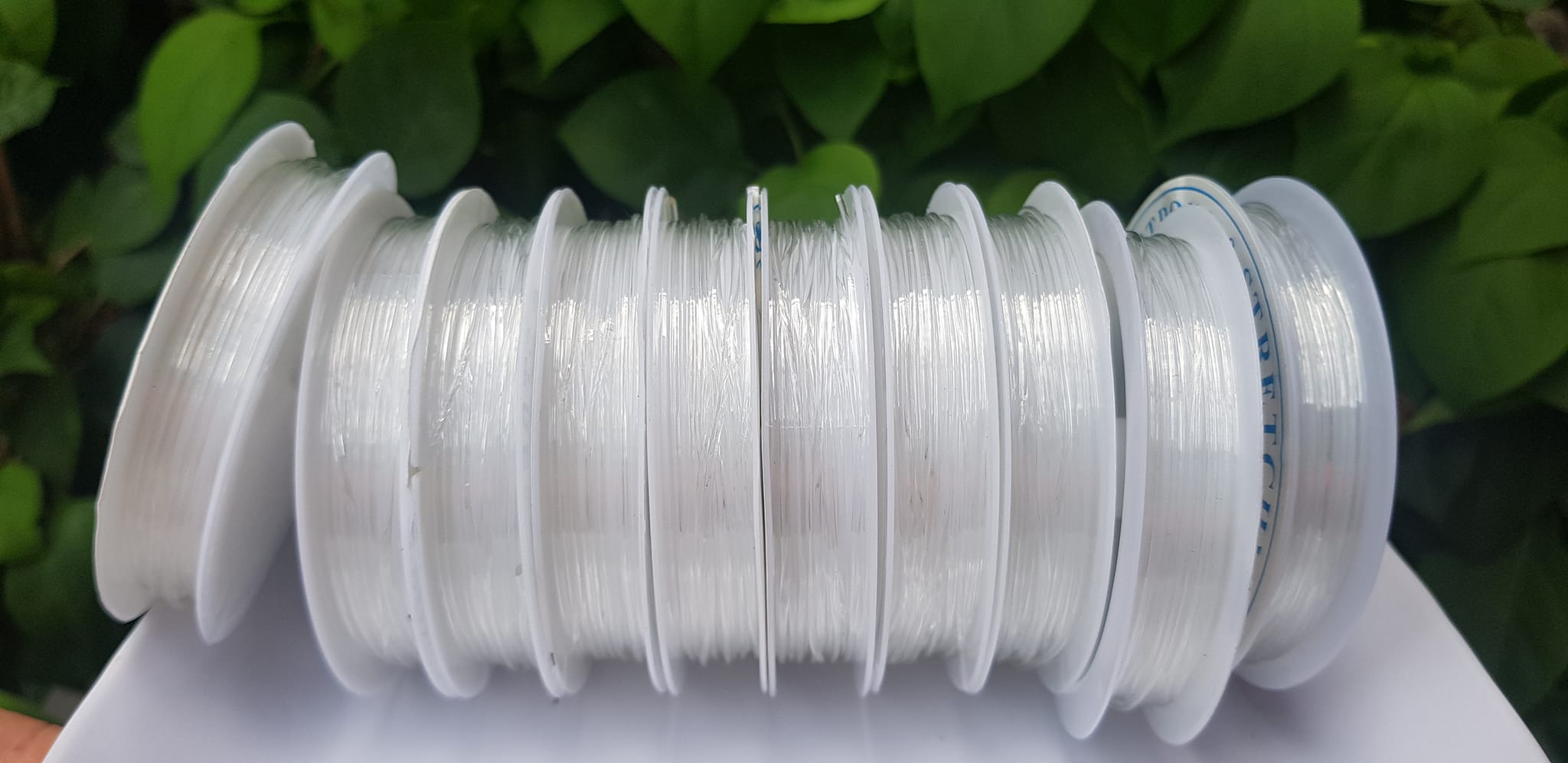 Khoanh tròn cuộn Thun Dẻo Màu trắng nhỏ chuyên xỏ tất cả vòng đeo tay Thun dẻo trắng xỏ vòng tay nam nữ ạ