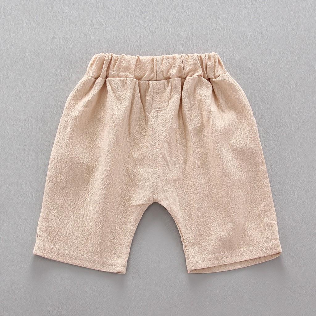 Set áo sơ mi ngắn tay họa tiết xe hơi và cây + quần đùi kem hàng quảng châu cho bé