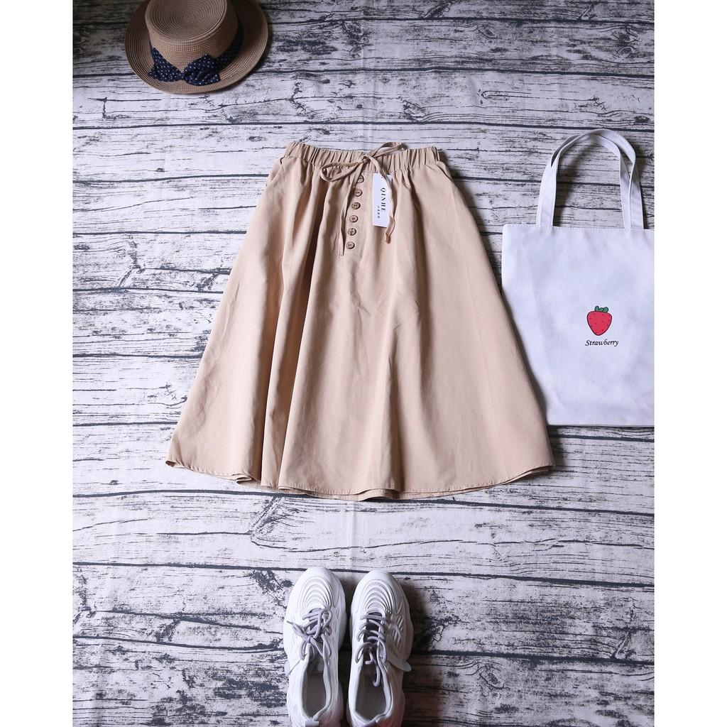 CHÂN VÁY MIDI NÚT GỖ ĐÍNH NƠ