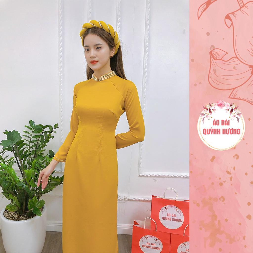 Áo dài lụa tây thi màu vàng cổ truyền thống đính hạt by Quỳnh Hương