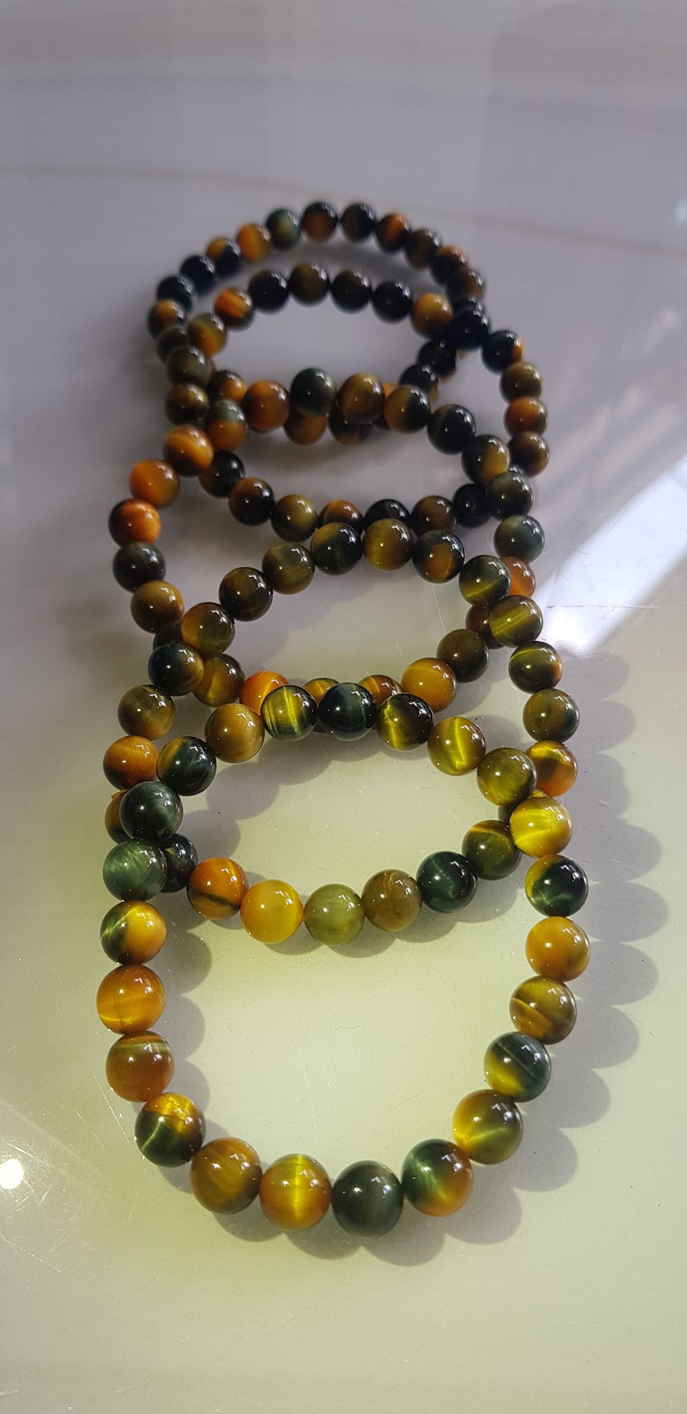 Vòng tay phong thủy may mắn Nữ đá mắt hổ tự nhiên vàng xanh đều mới bóng mượt đẹp Size hạt 8mm Nữ đeo Công dụng vòng đá mắt hổ đá thiên nhiên tốt cho sức khỏe, đem đến may mắn,xoa dịu tâm trí công việc hanh thông ạ