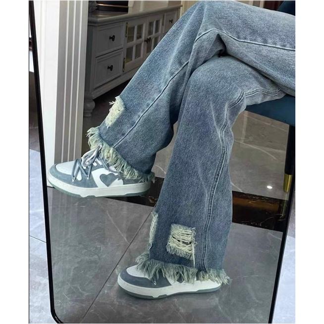 Quần jeans nữ ống rộng gấu tua rua