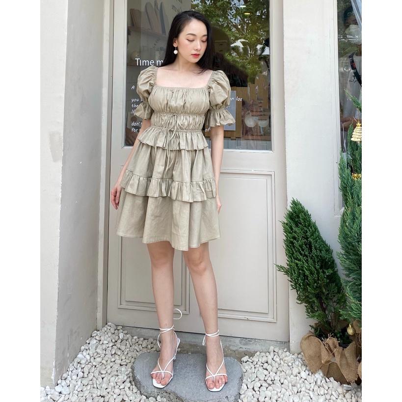 KIOBI – Đầm Artemis form mini ôm ngực, eo nhún thun, tay phồng, tùng xòe lai 2 tầng bèo, vải kate gân be - KID2112469B