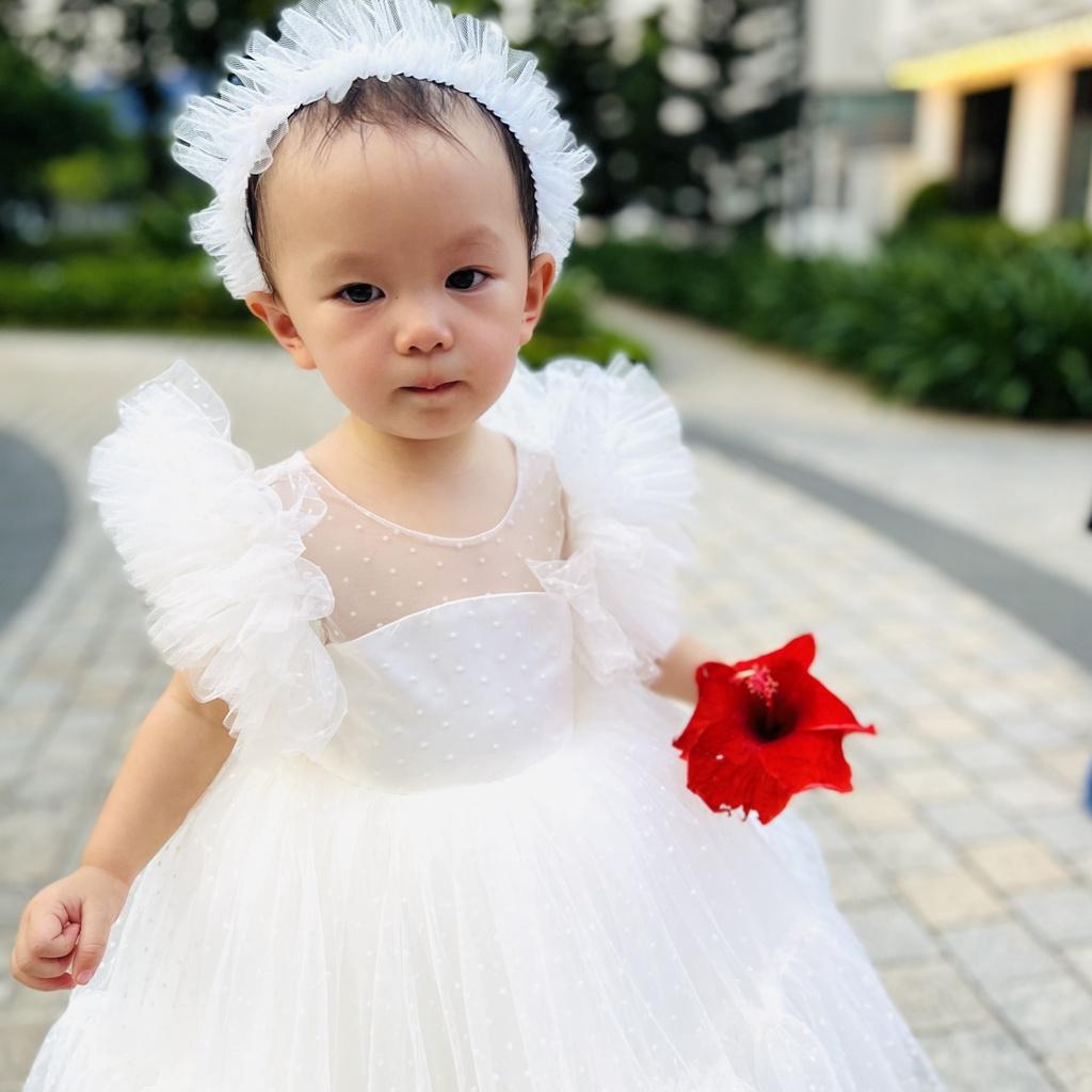 Váy công chúa đầm công chúa thiết kế chấm bi trắng xẻ lưng kẹp nơ cho bé gái từ 1 -10 tuổi tại Mom's choice