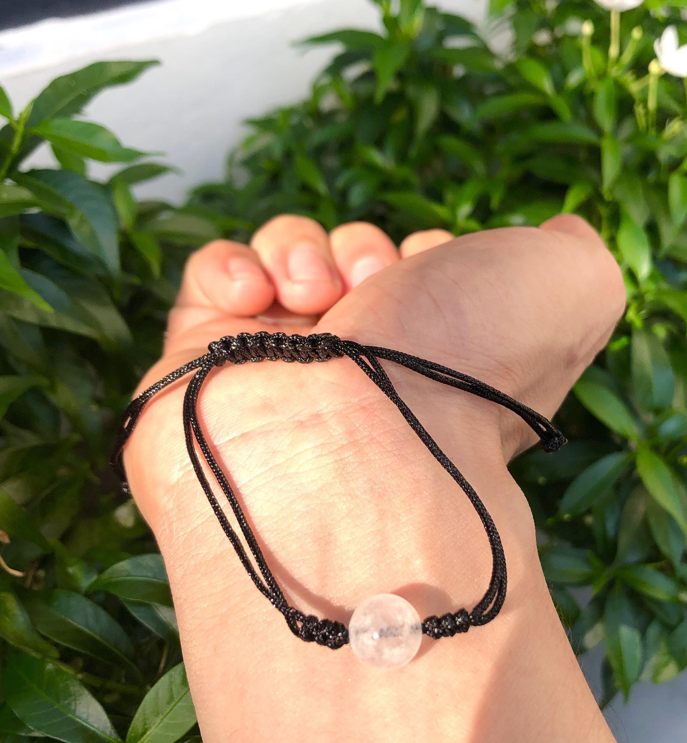 Vòng tay đá thạch anh trắng đan dây đen tự nhiên