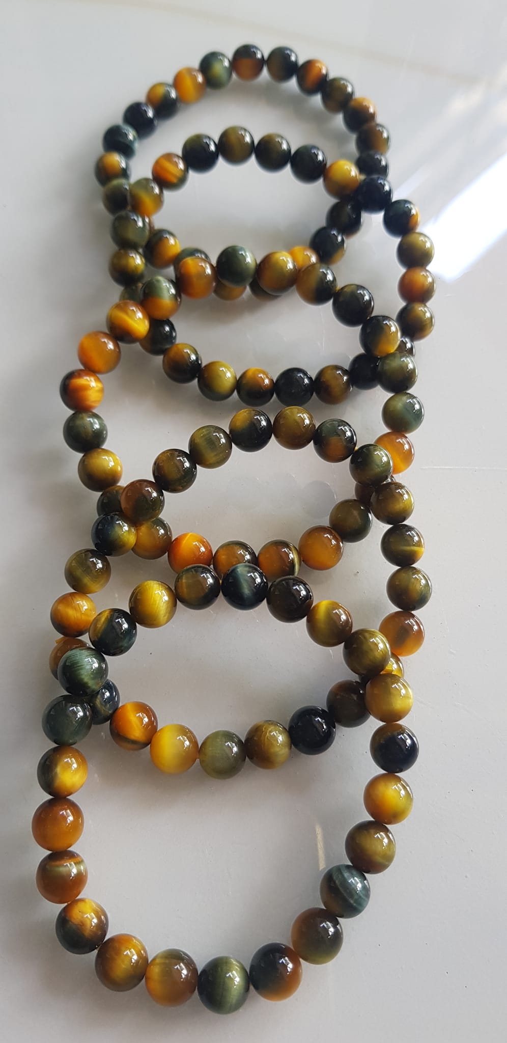 Vòng tay phong thủy may mắn Nữ đá mắt hổ tự nhiên vàng xanh đều mới bóng mượt đẹp Size hạt 8mm Nữ đeo Công dụng vòng đá mắt hổ đá thiên nhiên tốt cho sức khỏe, đem đến may mắn,xoa dịu tâm trí công việc hanh thông ạ