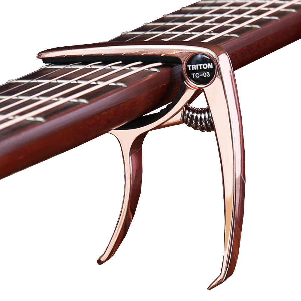 Capo Đàn Guitar/Ukulele Vân Gỗ Woim TC-03 ( Màu ngẫu nhiên )