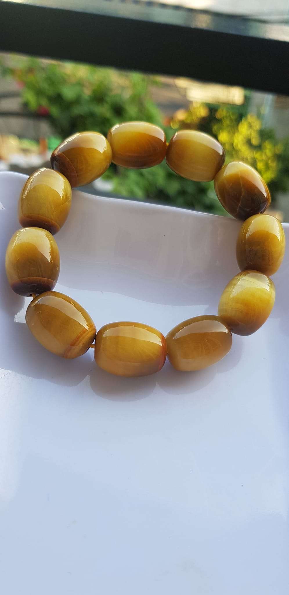 Vòng Tay Phong Thủy Nam Mệnh Thổ Kim Thủy Mới Đẹp Hạt Lu Thống Mới Vàng Nâu bóng đẹp Chất liệu đá mắt hổ tự nhiên vàng nâu bóng đẹp ạ Size hạt 14mm x dài 19mm ạ