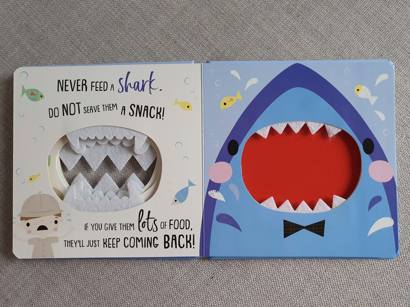 Never Feed a Shark - Không Bao Giờ Cho Cá Mập Ăn