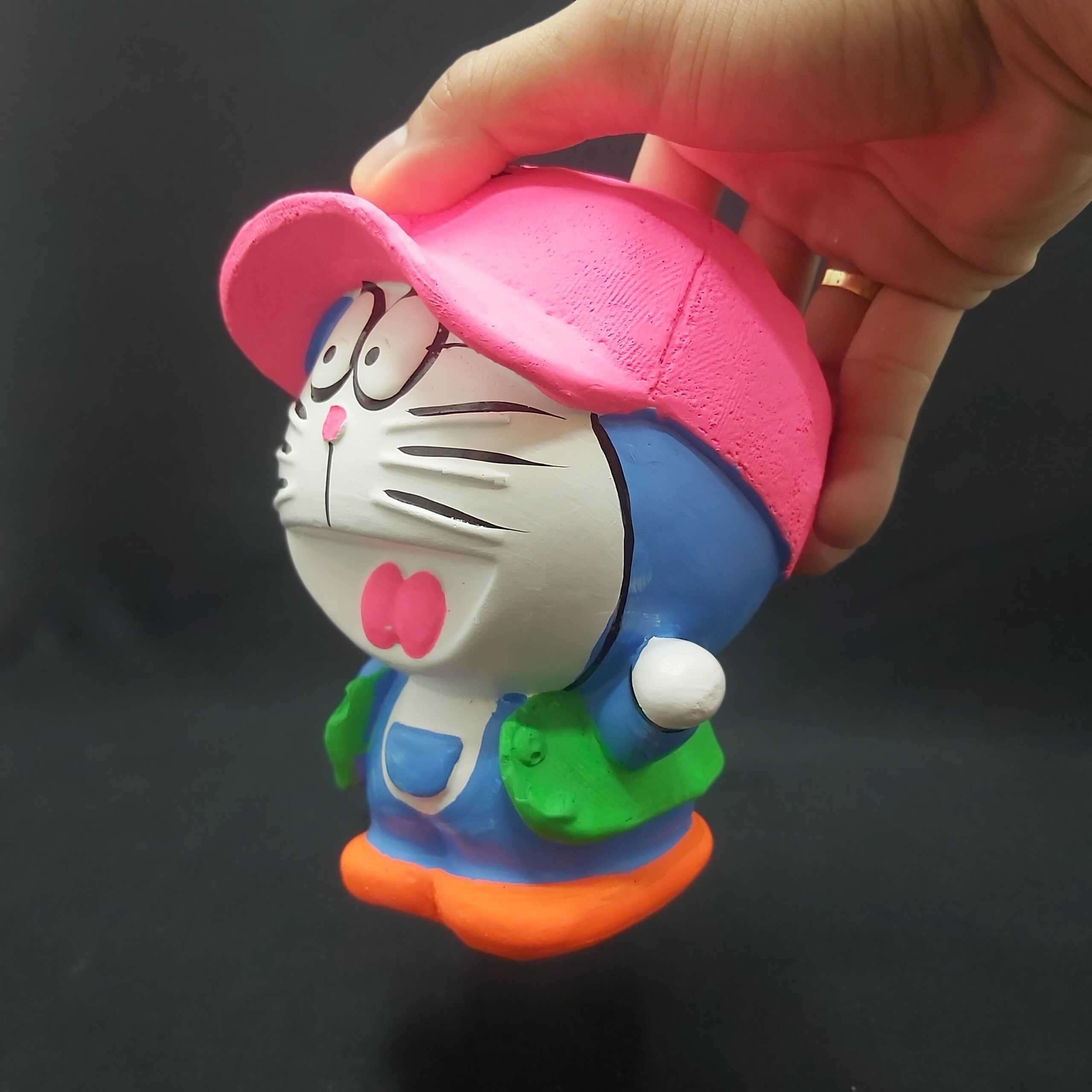 Ống heo tiết kiệm tiền nhỏ mẫu DORAEMON Đội Nón cực HOT – heo đất làm quà tặng sinh nhật được trẻ em yêu thích