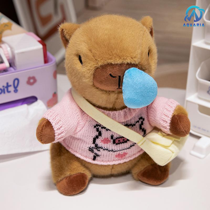 Gấu Bông Thú Nhồi Bông Capybara Mặc Áo Len Đeo Túi Có Thể Kéo Mũi Siêu Đáng Yêu 25cm (Mẫu Áo Len Ngẫu Nhiên)