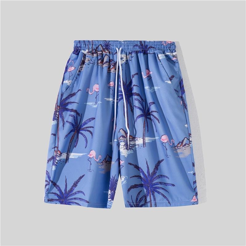 Bộ đồ đi biển gồm áo tay ngắn in hoa và quần dáng rộng phong cách Hawaii dành cho nam