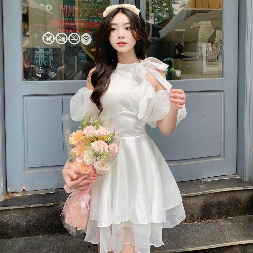 Đầm xòe tầng khoét vai cột nơ tay phồng