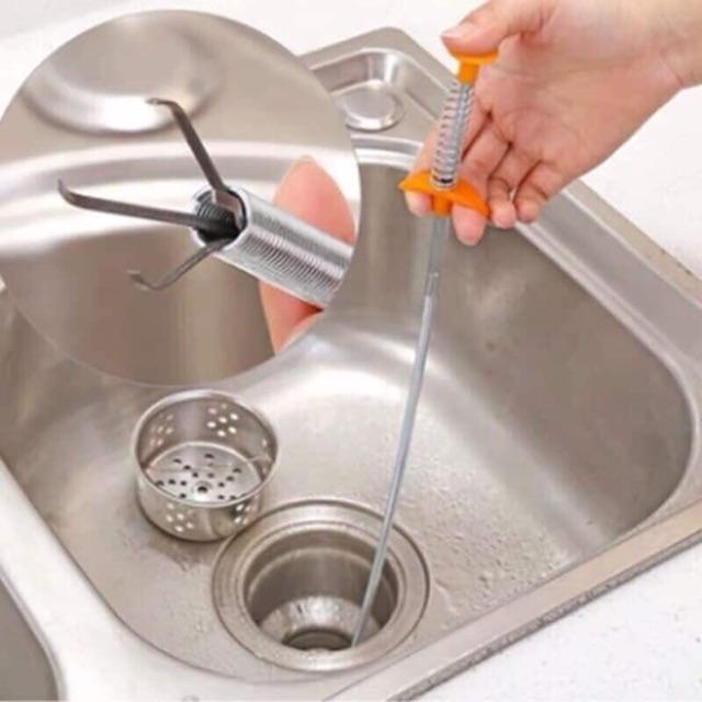 Que thông tắc cống