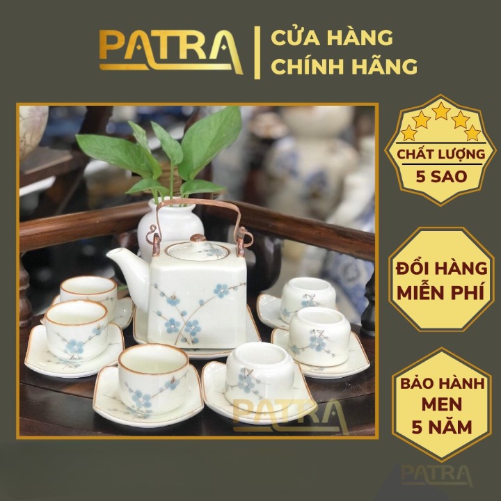 Bộ ấm chén uống trà cao cấp , bộ ấm trà Bát Tràng men kem họa tiết hoa đào xanh quai đồng