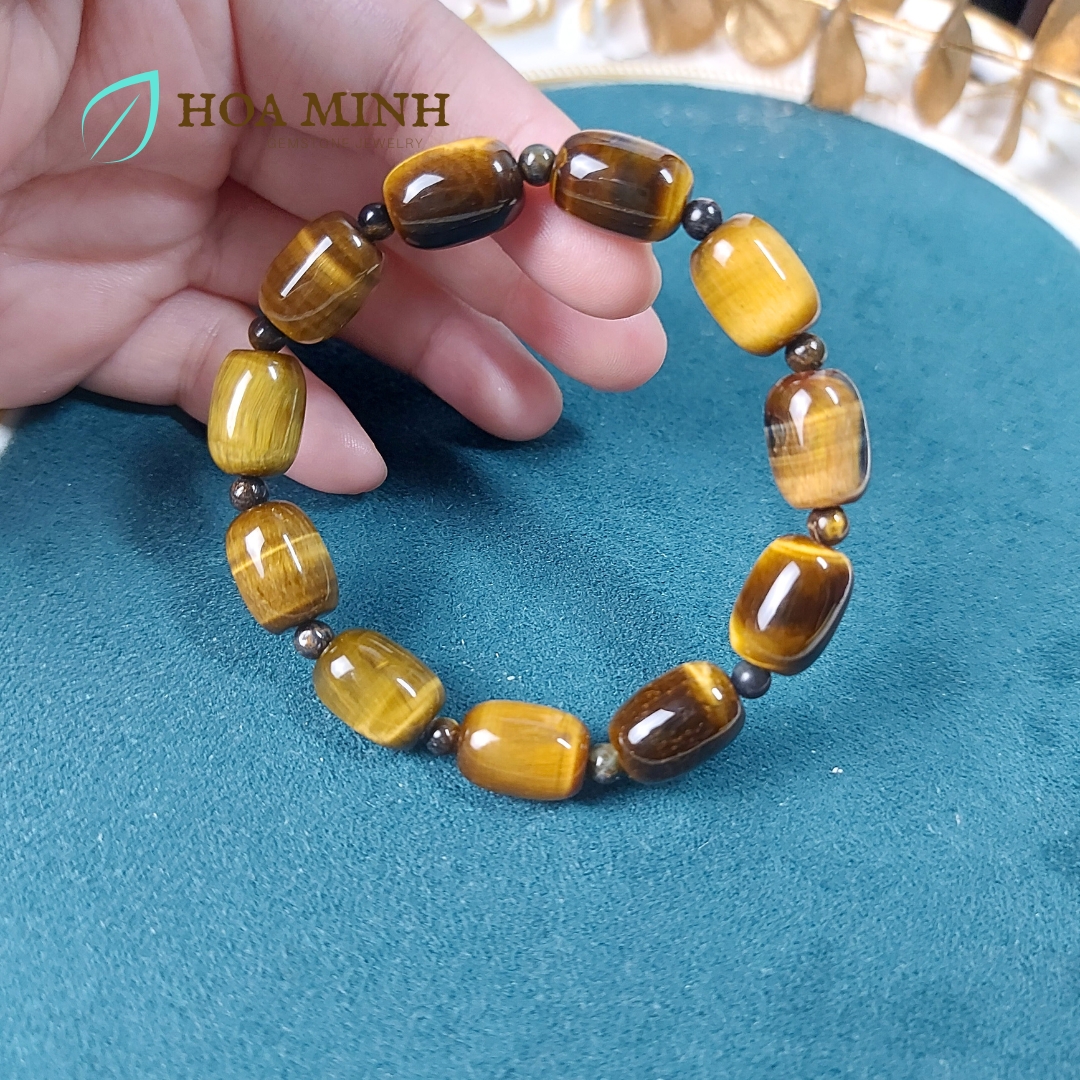 Vòng tay đá Mắt Hổ vàng nâu size 14x10 li chất 4A kiểu lu thống phối xen kẽ viên mắt hổ tròn