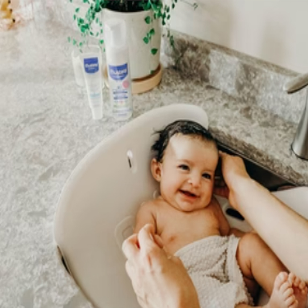 Dầu Gội hỗ trợ điều trị Cứt Trâu Mustela