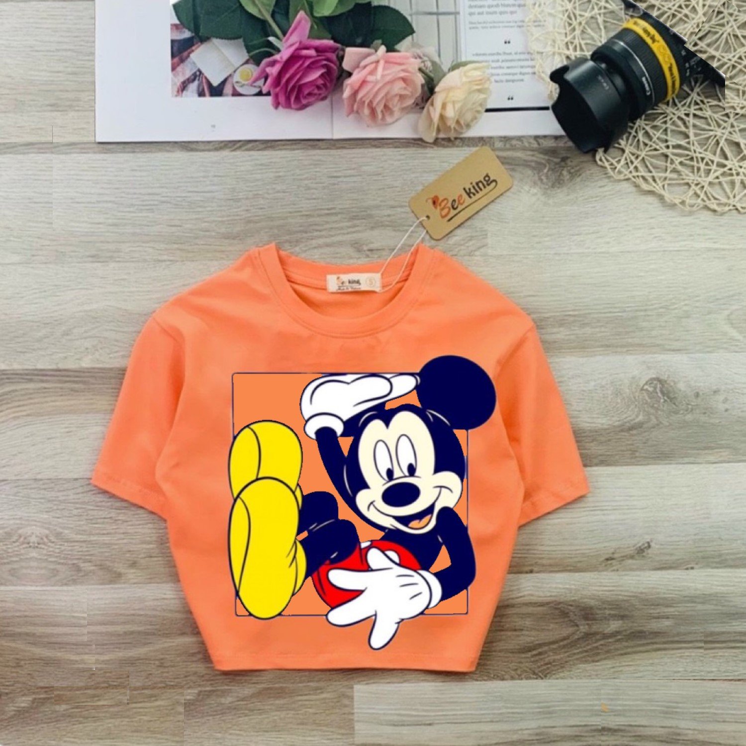 G0314 Áo thun croptop Mickey màu cam cho bé gái