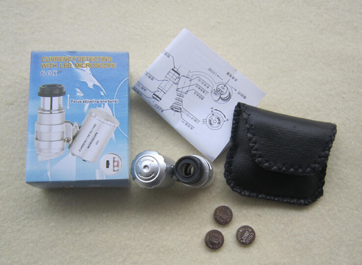 Kính lúp mini phóng đại 60x gập tích hợp 2 đèn led trắng và tím dễ dàng ( Tặng kèm đèn pin cơ bóp tay thân thiện với môi trường )