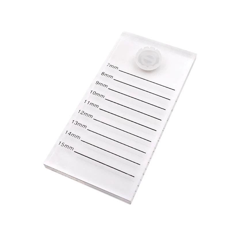 Khay mica nhựa dẻo để line mi và keo có chia vạch theo độ dài mi, bền đẹp ko lo hư vỡ, trên khay có sẵn 1 nút hoa
