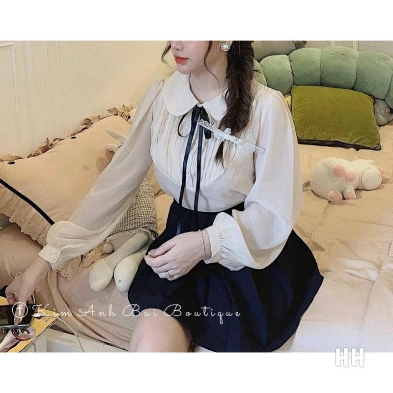ÁO SƠ MI MÀU BE CỔ SEN XẾP LY NGỰC NƠ ĐEN
