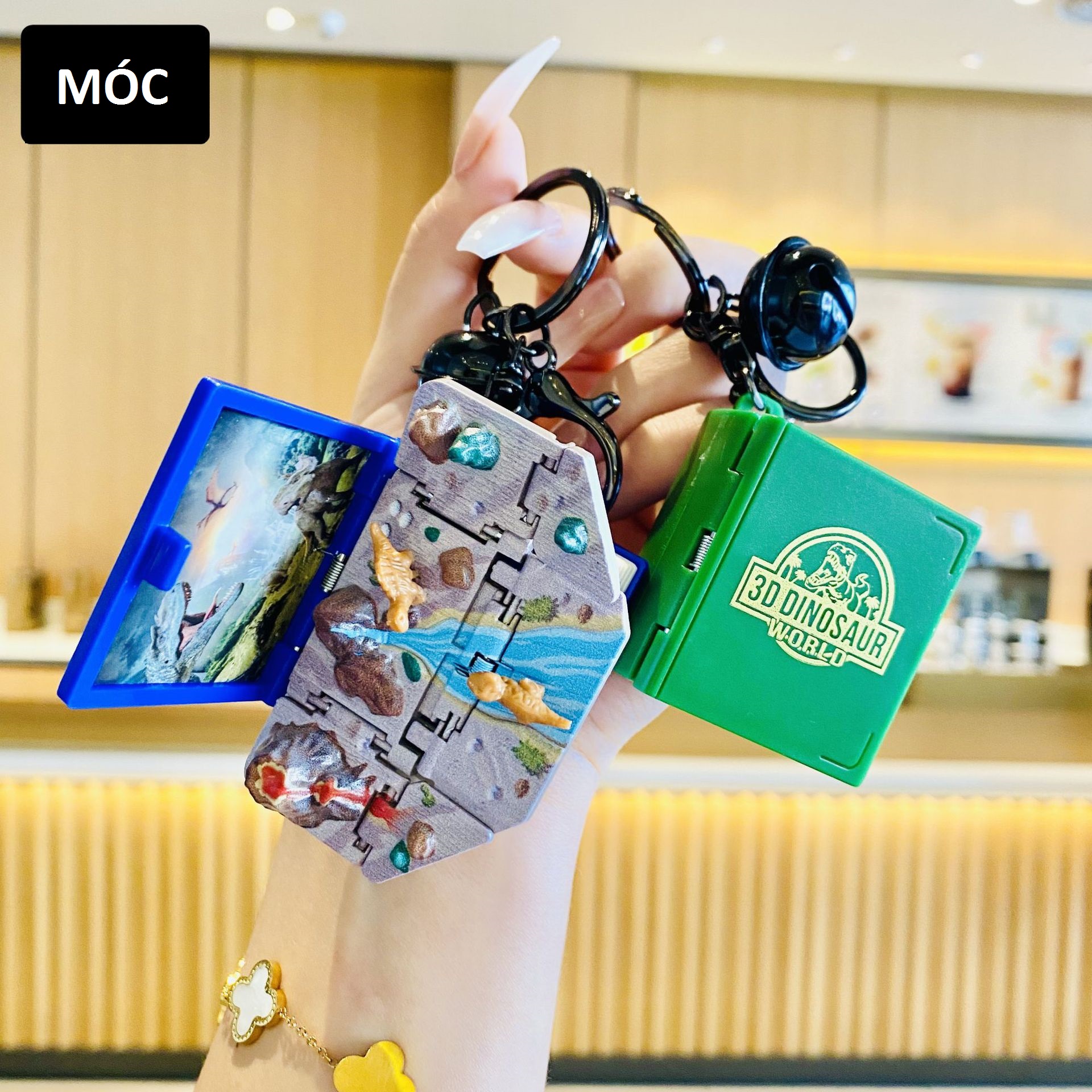 Móc khóa quyển sách khủng long - mở ra là mô hình