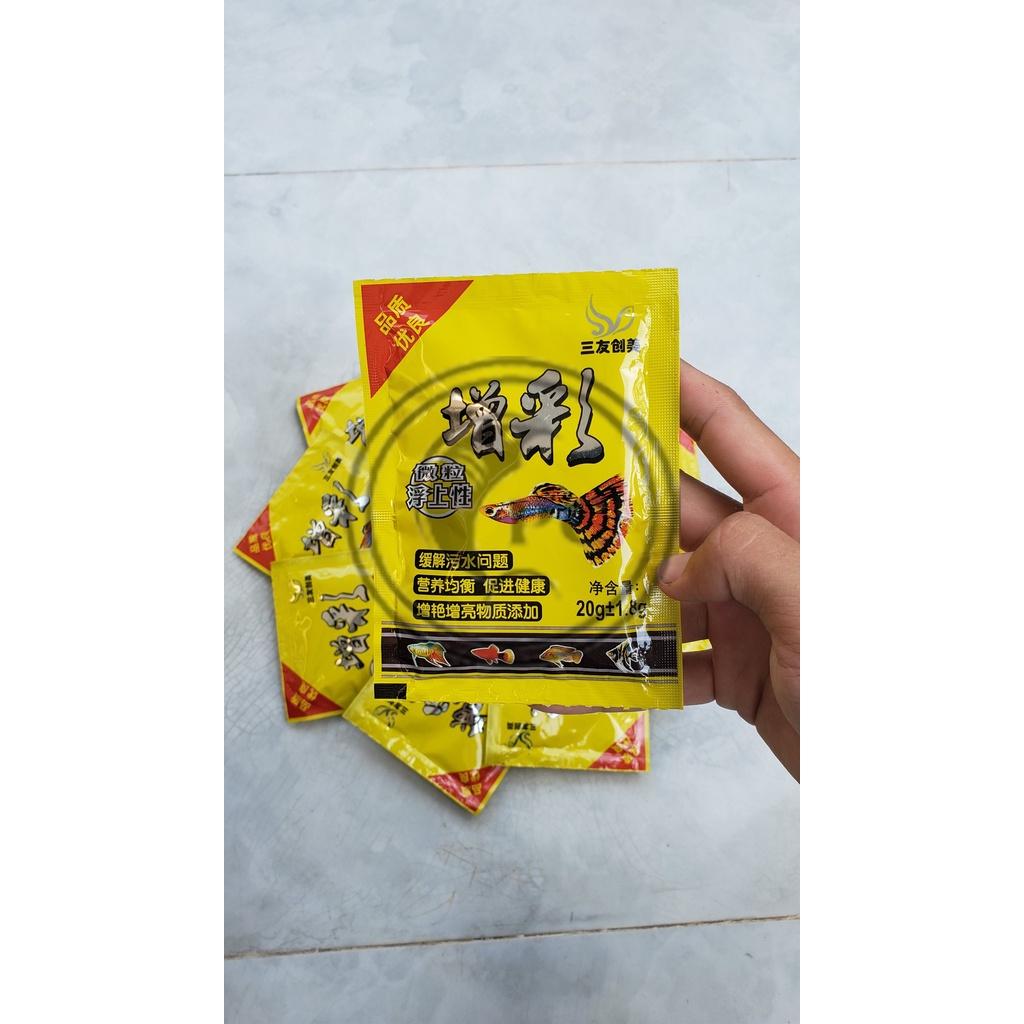 Thức ăn cho cá 7 màu Guppy Túi vàng 20gr giàu dinh dưỡng giúp cá mau lớn