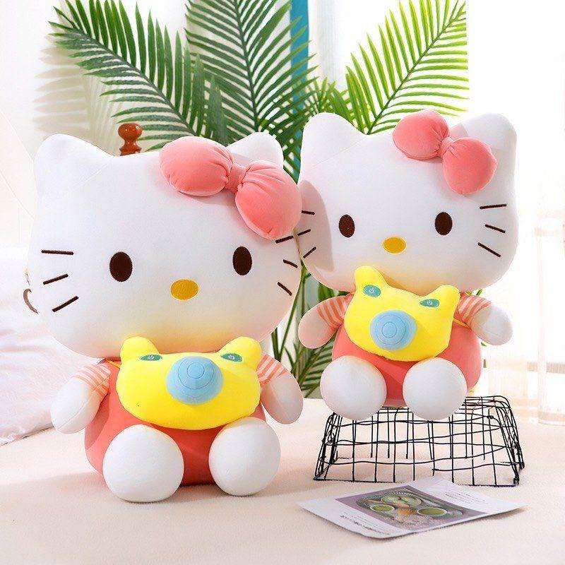 BÔNG KITTY/ GẤU BÔNG HÌNH KITTY CHO BÉ MẪU KITTY ĐEO MÁY ẢNH MẶC ÁO ĐI DU LỊCH SIZE 35CM (trái dâu tây)