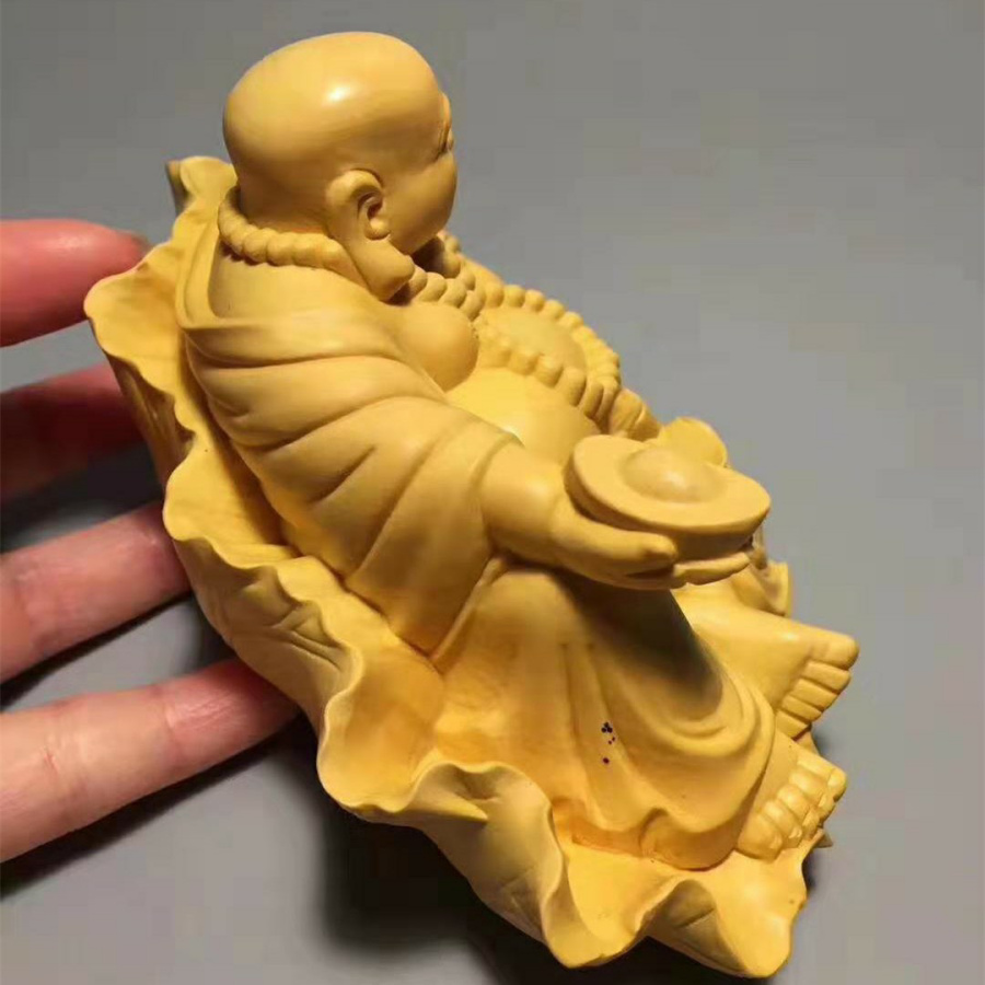 TƯỢNG PHẬT DI LẶC NGỒI LÁ SEN CẦM THỎI VÀNG GỖ HOÀNG DƯƠNG CAO 7 cm