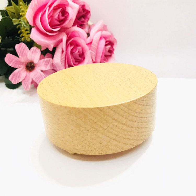 hộp nhạc khắc gỗ đế tròn 