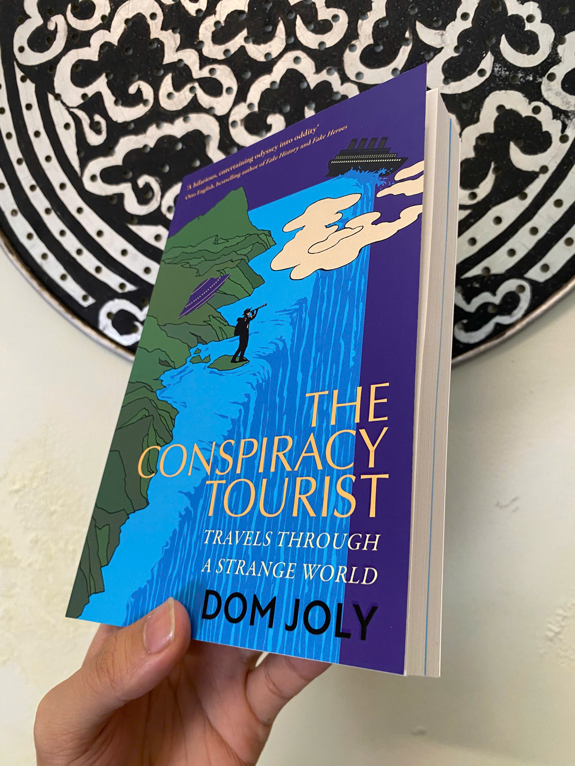 Sách - The Conspiracy Tourist: Travels Through a Strange World by Dom Joly | Travel Nonfiction