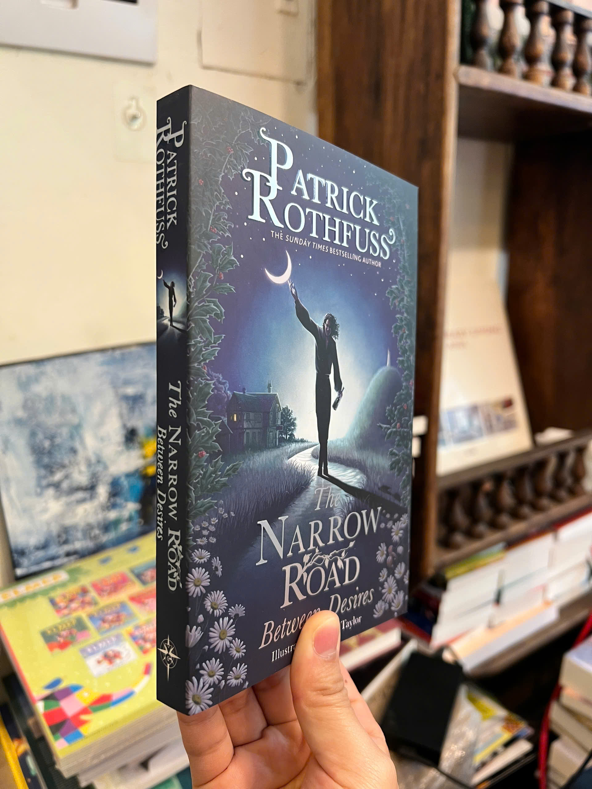 Sách - The Narrow Road Between Desires by Patrick Rothfuss | Fantasy / Young Adult / Ngoại văn