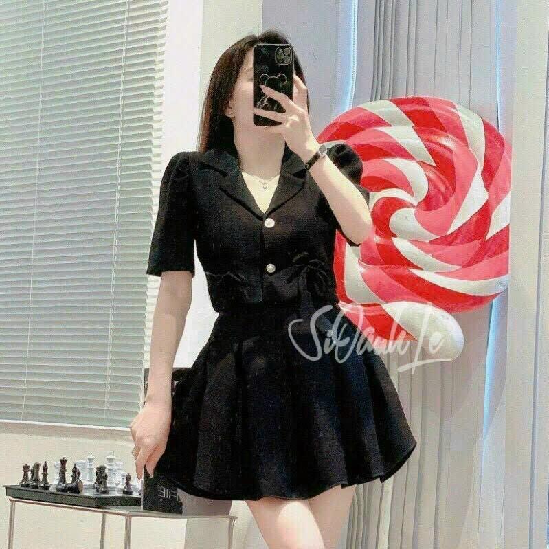 Sét áo vest phom lửng đính nơ và chân váy xoè xếp ly