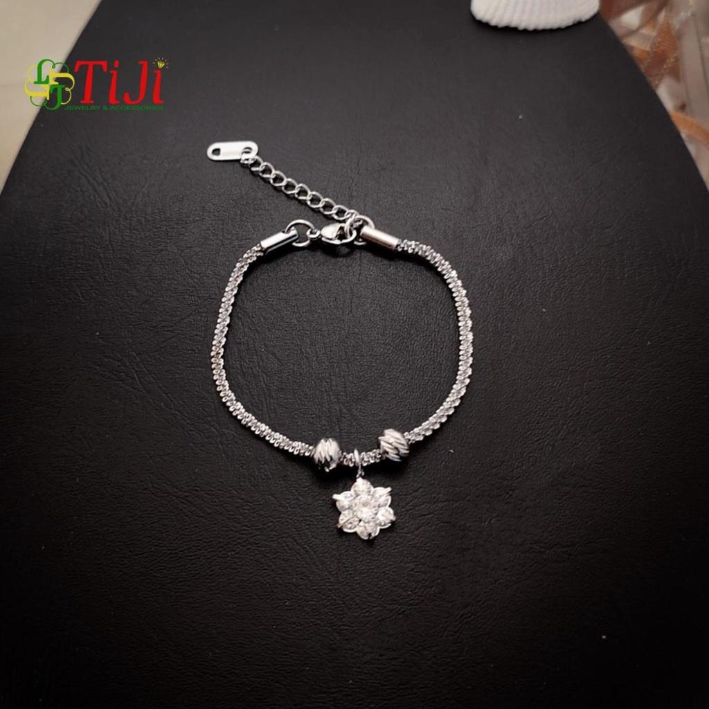 Lắc tay nữ inox kiểu xoắn xỏ bi chạm chiếu rớt hoa mai 6 cánh sáng đẹp không đen không gỉ sét