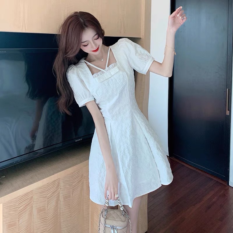 Đầm gấm nơ ngực đan dây chéo