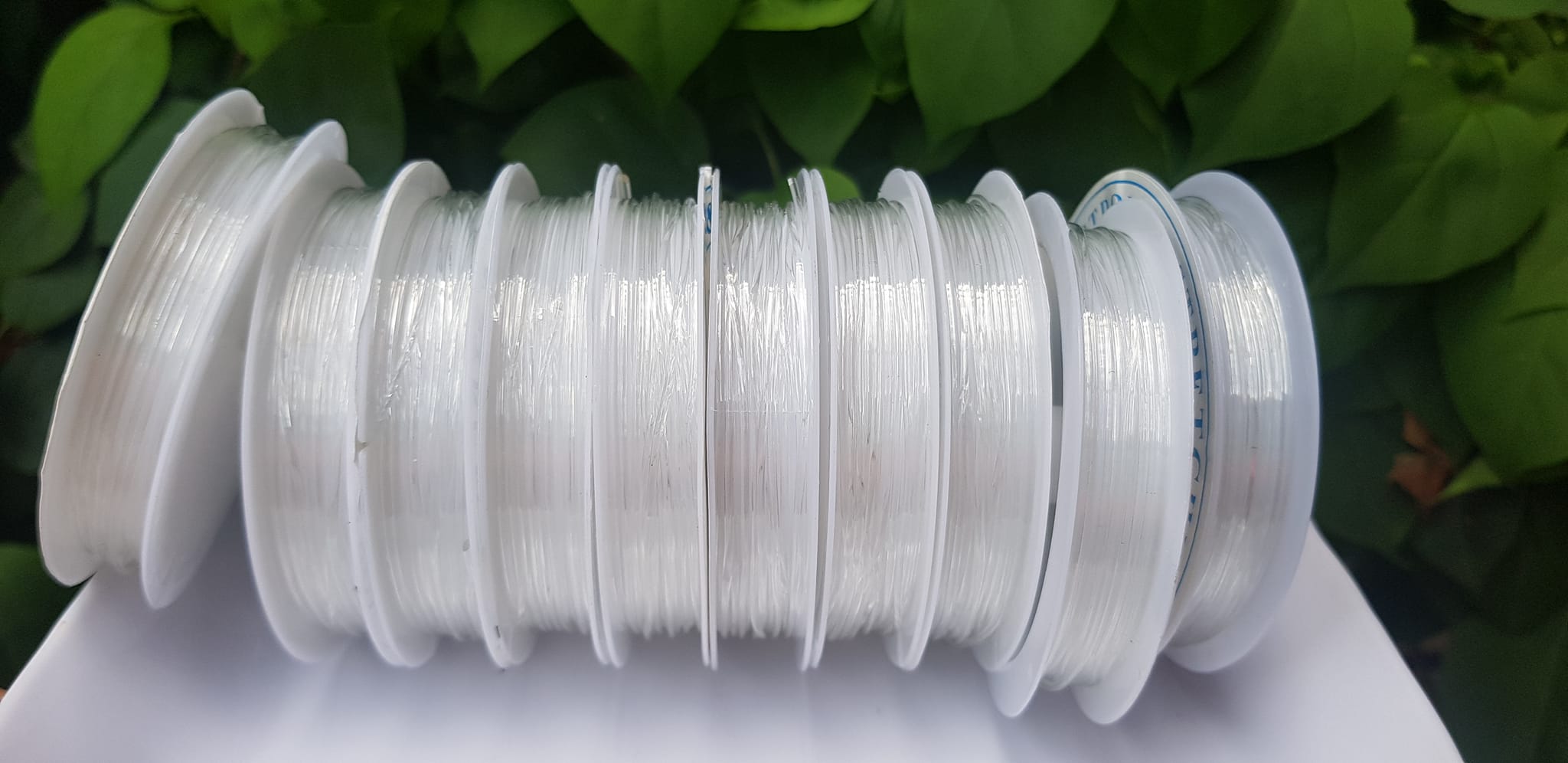 Khoanh tròn cuộn Thun Dẻo Màu trắng nhỏ chuyên xỏ tất cả vòng đeo tay Thun dẻo trắng xỏ vòng tay nam nữ ạ