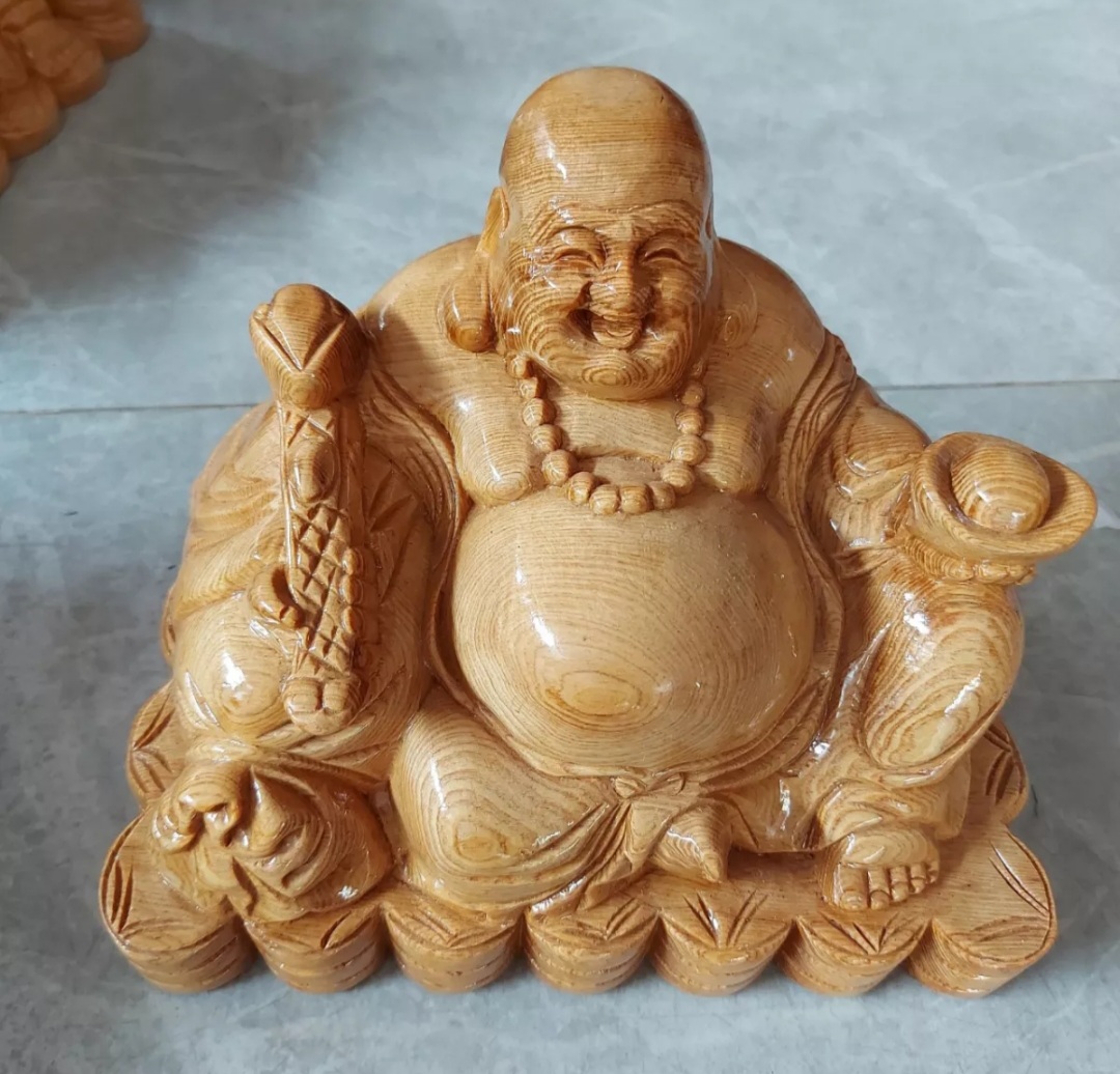 Tượng phật di lặc ngồi gỗ pomu ngang 25cm