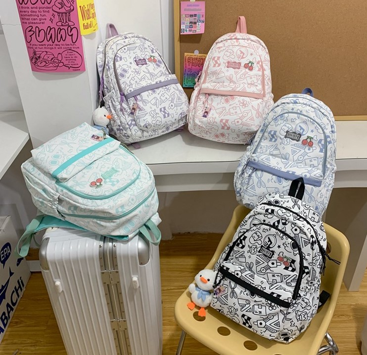 Balo vải học sinh, sinh viên thời trang in hình Doodle Dụng cụ học tập lạ mắt